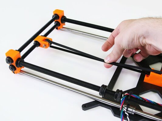 Tensioning the belt